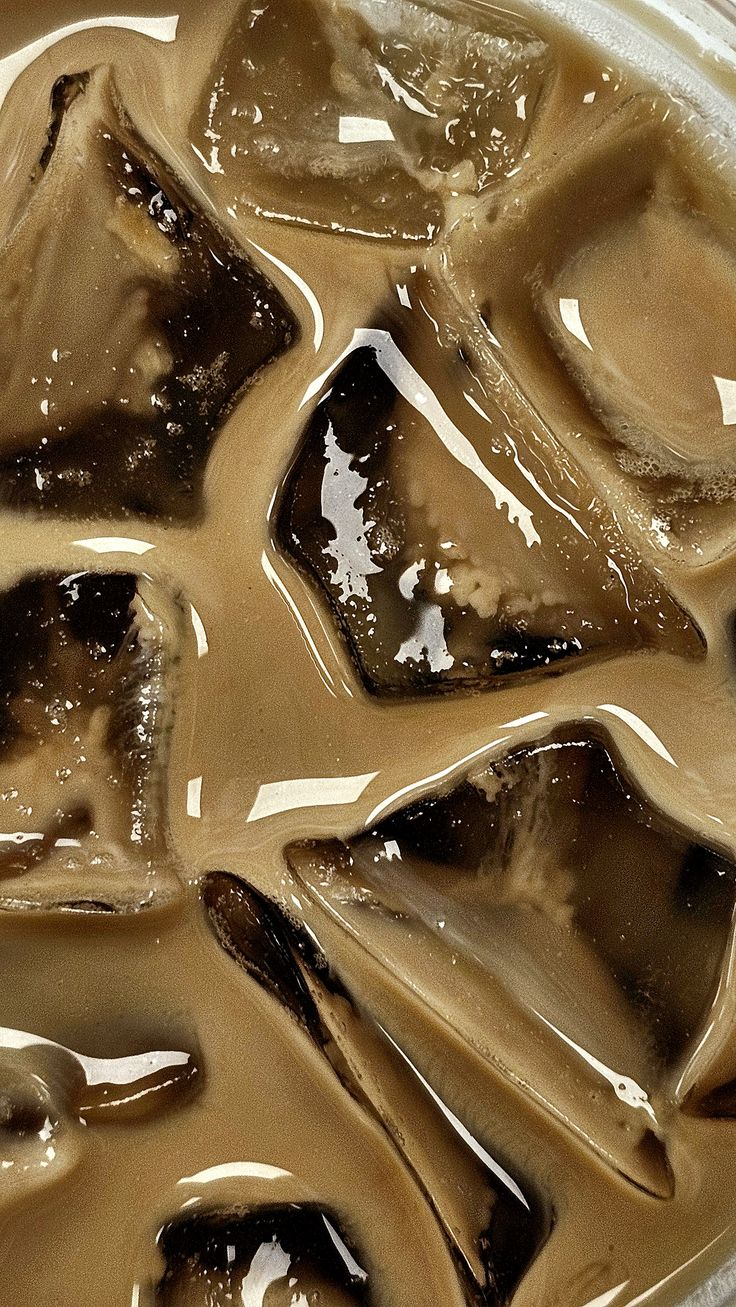 Macro shot of iced coffee with ice cubes
